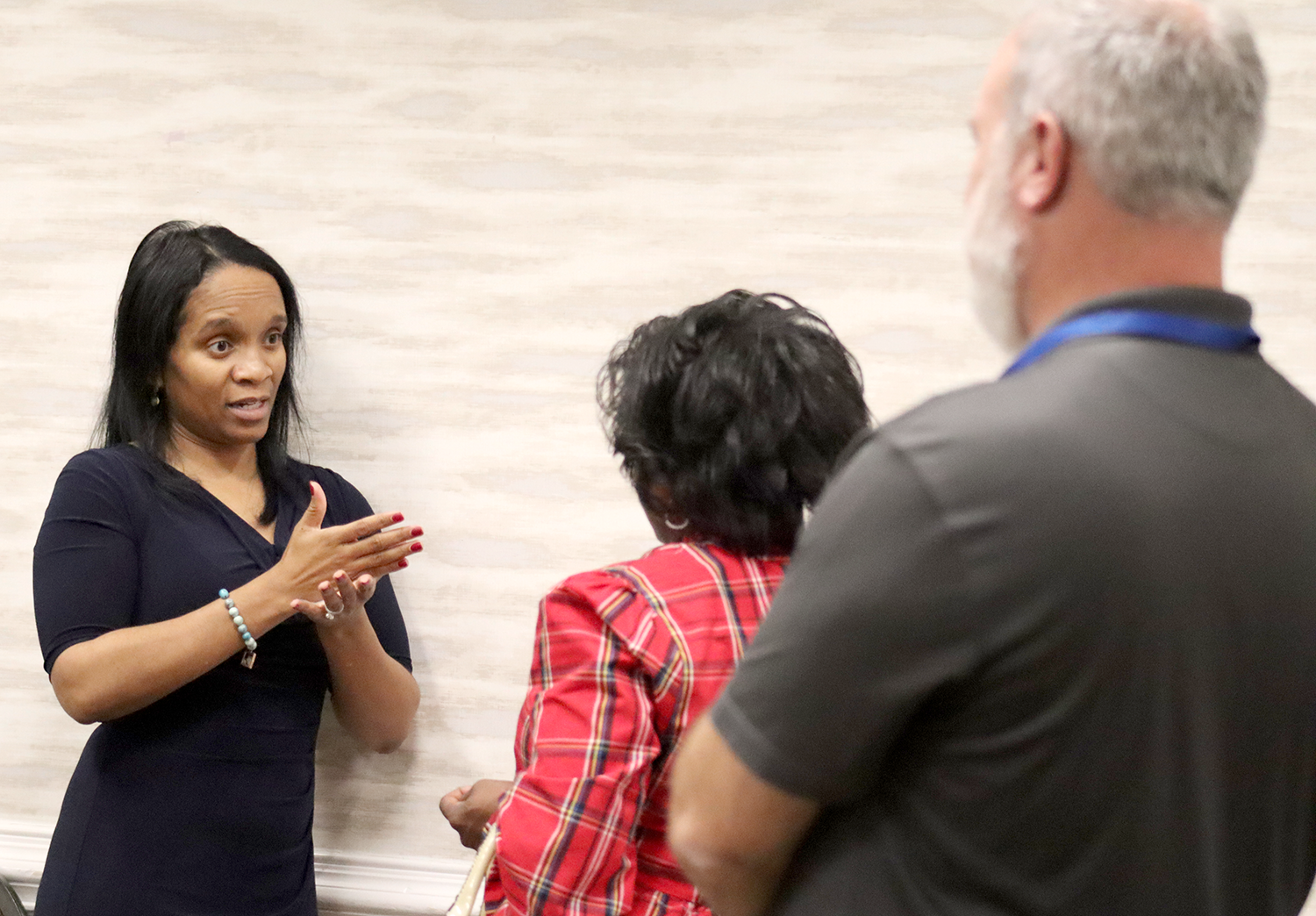 Meghan Dayson talks with attendees of the newly elected county council member orientation.